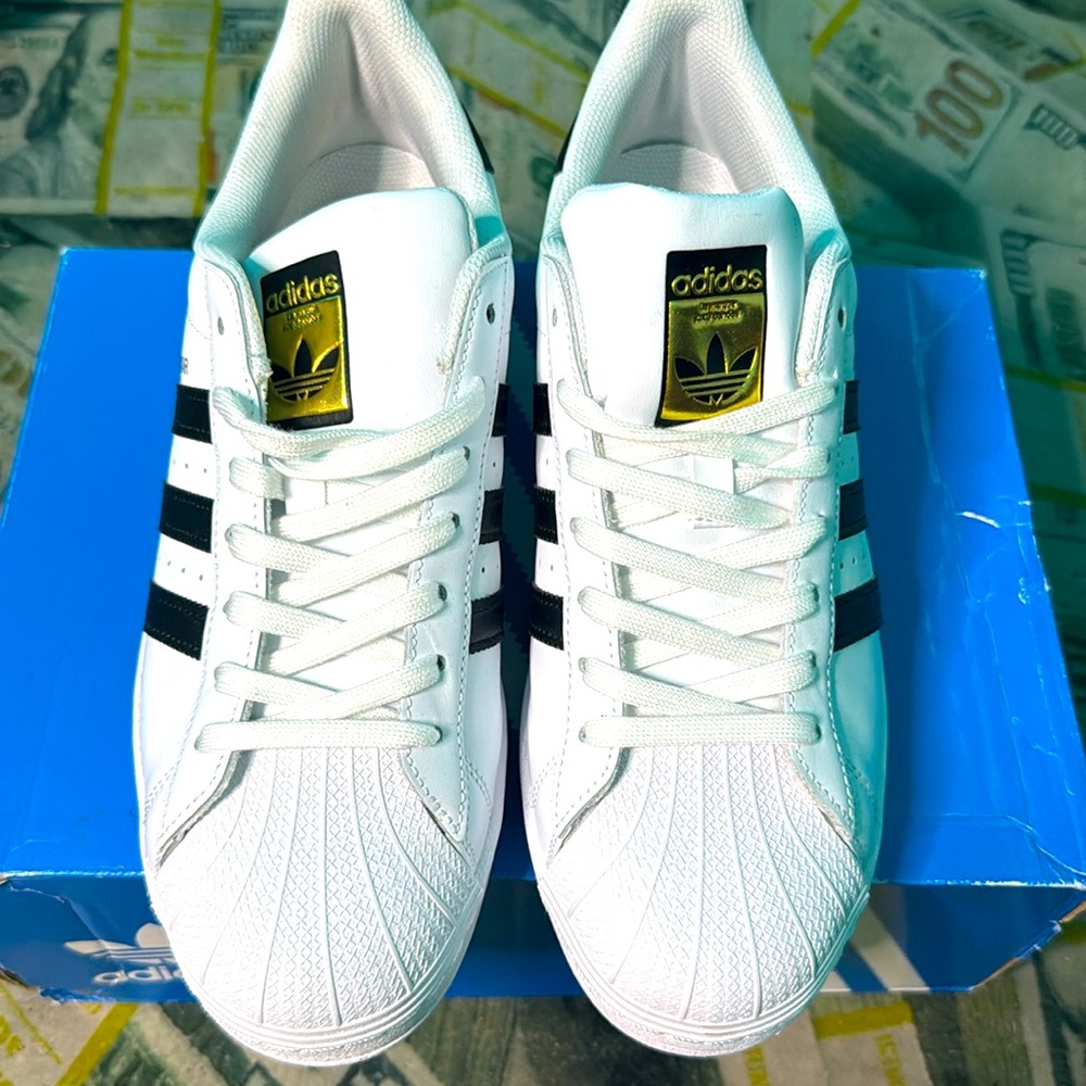 All white/ black stripes Superstar adidas originals. Worn once. Size 10